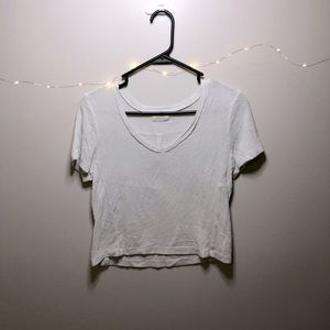 A PST crop top shirts. In the color white!